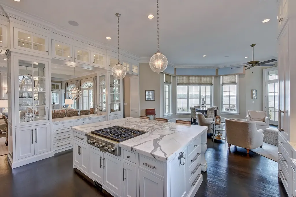 Indulge in the allure and character of the New England coast with this extraordinary Lake Norman estate. As you enter through the private gated drive, you'll be greeted by lush landscaping, creating a gardener's paradise. The estate offers wide open, long-range panoramic views that will take your breath away.