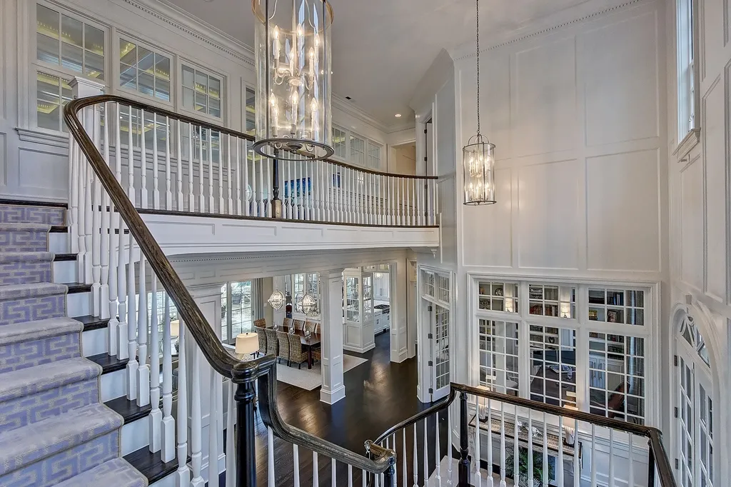Indulge in the allure and character of the New England coast with this extraordinary Lake Norman estate. As you enter through the private gated drive, you'll be greeted by lush landscaping, creating a gardener's paradise. The estate offers wide open, long-range panoramic views that will take your breath away.
