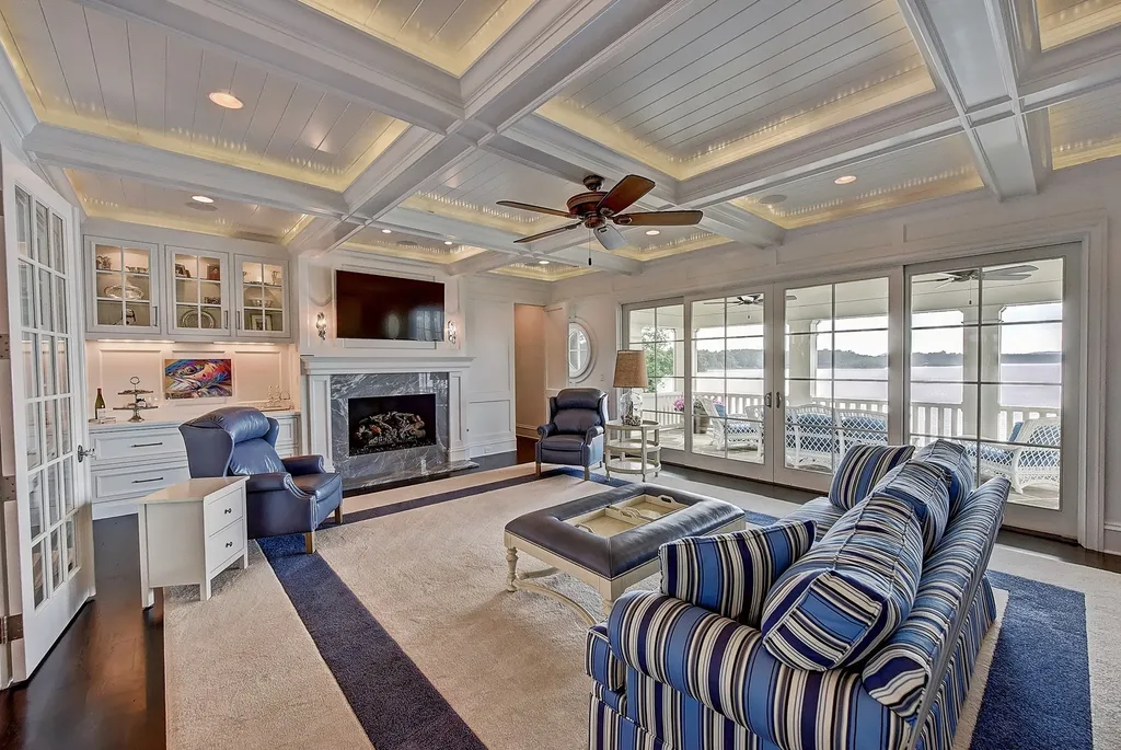 Indulge in the allure and character of the New England coast with this extraordinary Lake Norman estate. As you enter through the private gated drive, you'll be greeted by lush landscaping, creating a gardener's paradise. The estate offers wide open, long-range panoramic views that will take your breath away.