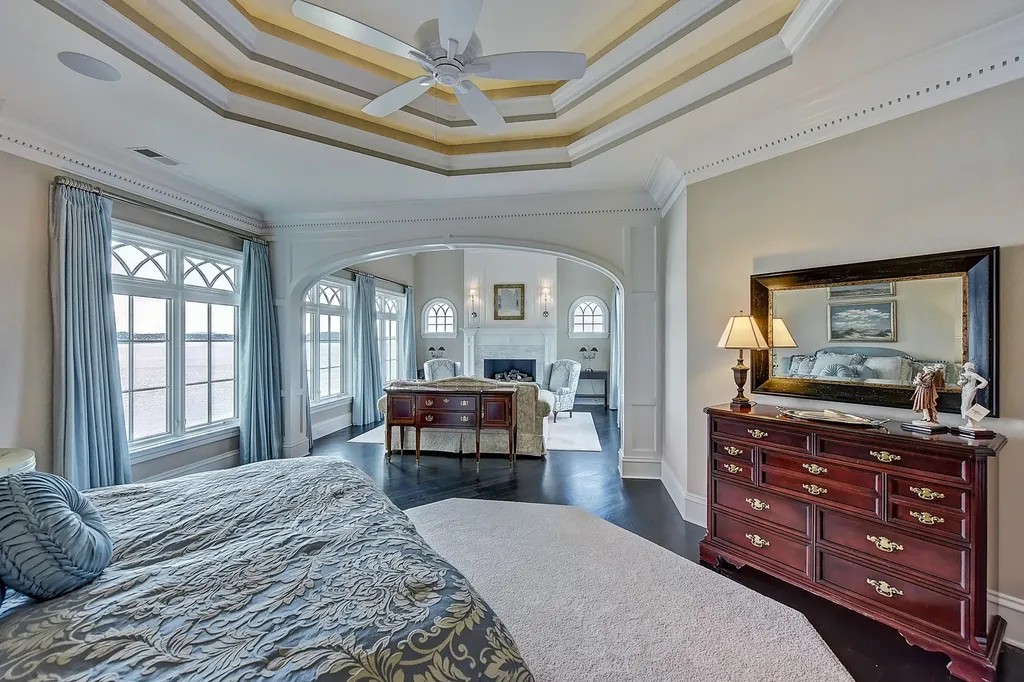 Indulge in the allure and character of the New England coast with this extraordinary Lake Norman estate. As you enter through the private gated drive, you'll be greeted by lush landscaping, creating a gardener's paradise. The estate offers wide open, long-range panoramic views that will take your breath away.