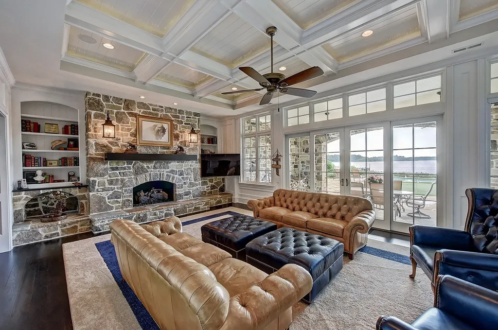 Indulge in the allure and character of the New England coast with this extraordinary Lake Norman estate. As you enter through the private gated drive, you'll be greeted by lush landscaping, creating a gardener's paradise. The estate offers wide open, long-range panoramic views that will take your breath away.
