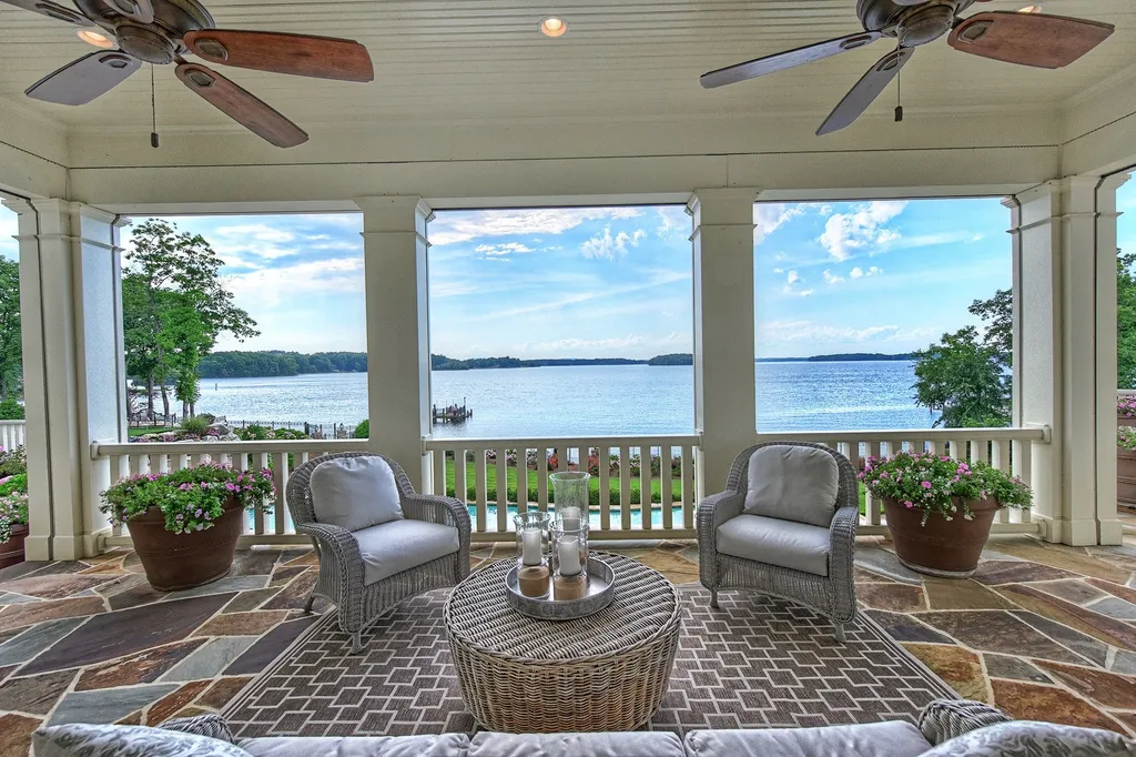 Indulge in the allure and character of the New England coast with this extraordinary Lake Norman estate. As you enter through the private gated drive, you'll be greeted by lush landscaping, creating a gardener's paradise. The estate offers wide open, long-range panoramic views that will take your breath away.