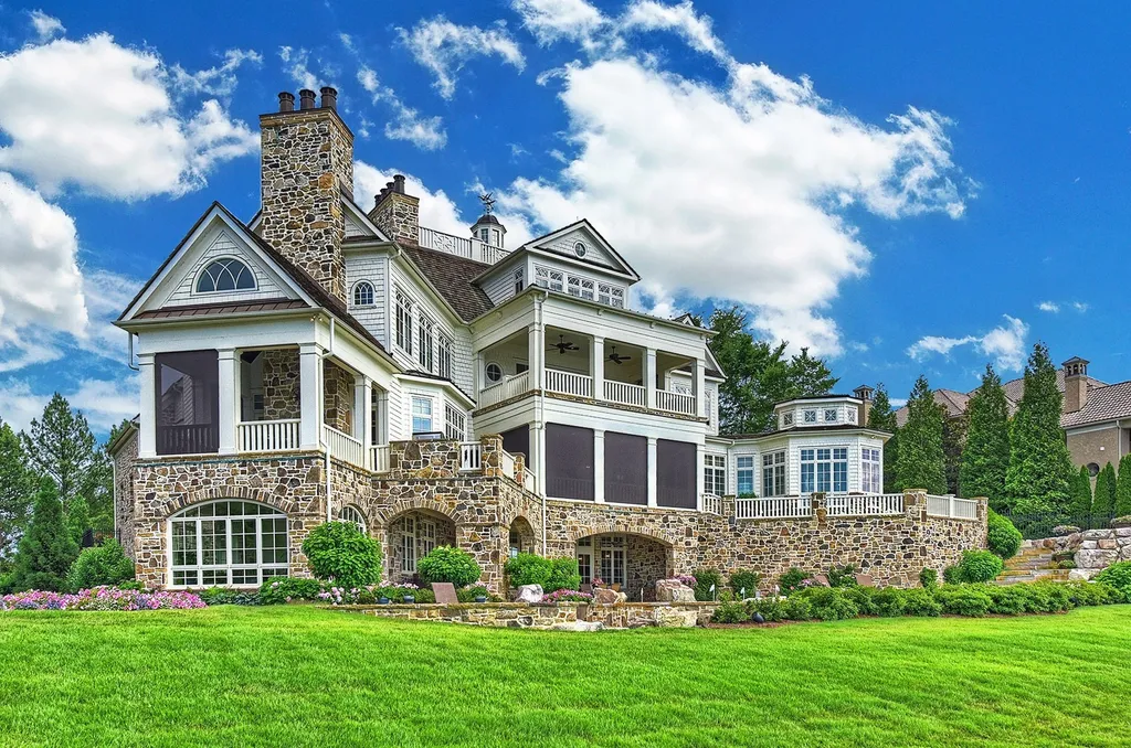 Indulge in the allure and character of the New England coast with this extraordinary Lake Norman estate. As you enter through the private gated drive, you'll be greeted by lush landscaping, creating a gardener's paradise. The estate offers wide open, long-range panoramic views that will take your breath away.