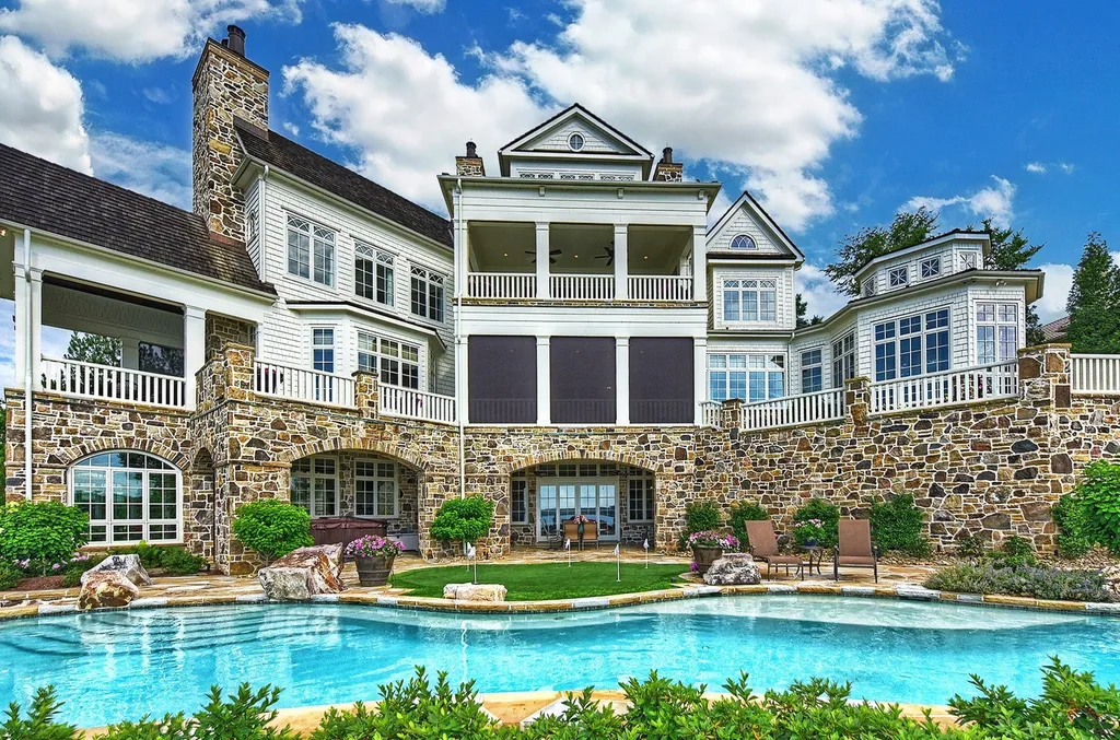 Indulge in the allure and character of the New England coast with this extraordinary Lake Norman estate. As you enter through the private gated drive, you'll be greeted by lush landscaping, creating a gardener's paradise. The estate offers wide open, long-range panoramic views that will take your breath away.