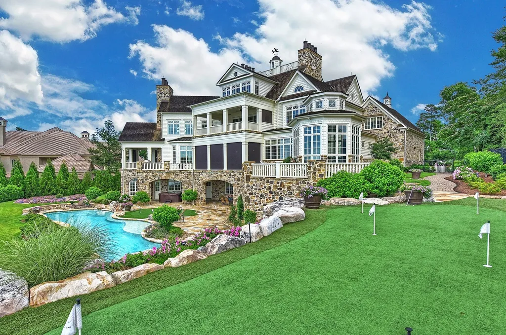 Indulge in the allure and character of the New England coast with this extraordinary Lake Norman estate. As you enter through the private gated drive, you'll be greeted by lush landscaping, creating a gardener's paradise. The estate offers wide open, long-range panoramic views that will take your breath away.