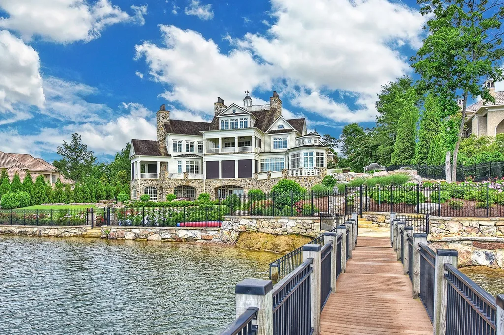 Indulge in the allure and character of the New England coast with this extraordinary Lake Norman estate. As you enter through the private gated drive, you'll be greeted by lush landscaping, creating a gardener's paradise. The estate offers wide open, long-range panoramic views that will take your breath away.