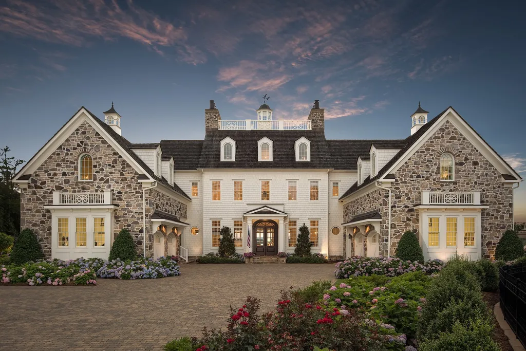 Indulge in the allure and character of the New England coast with this extraordinary Lake Norman estate. As you enter through the private gated drive, you'll be greeted by lush landscaping, creating a gardener's paradise. The estate offers wide open, long-range panoramic views that will take your breath away.