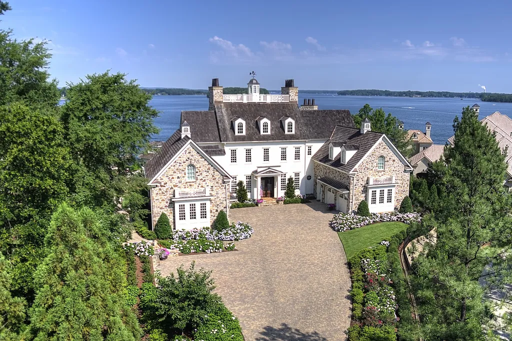 Indulge in the allure and character of the New England coast with this extraordinary Lake Norman estate. As you enter through the private gated drive, you'll be greeted by lush landscaping, creating a gardener's paradise. The estate offers wide open, long-range panoramic views that will take your breath away.