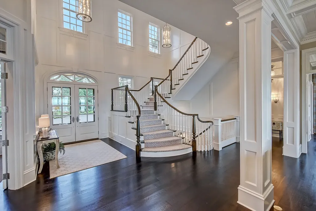 Indulge in the allure and character of the New England coast with this extraordinary Lake Norman estate. As you enter through the private gated drive, you'll be greeted by lush landscaping, creating a gardener's paradise. The estate offers wide open, long-range panoramic views that will take your breath away.