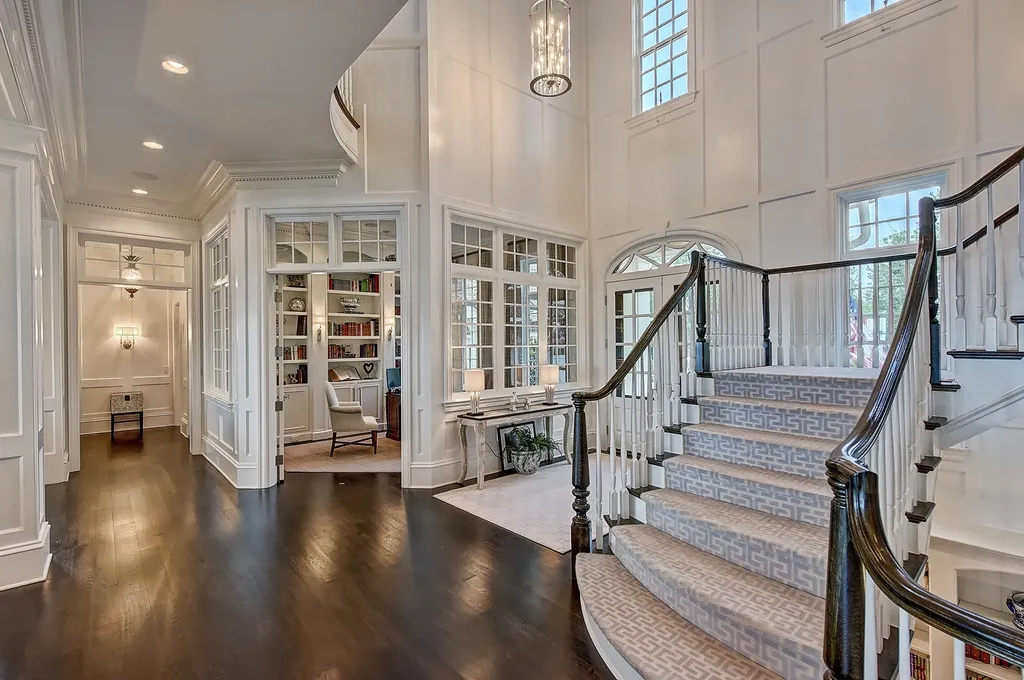 Indulge in the allure and character of the New England coast with this extraordinary Lake Norman estate. As you enter through the private gated drive, you'll be greeted by lush landscaping, creating a gardener's paradise. The estate offers wide open, long-range panoramic views that will take your breath away.