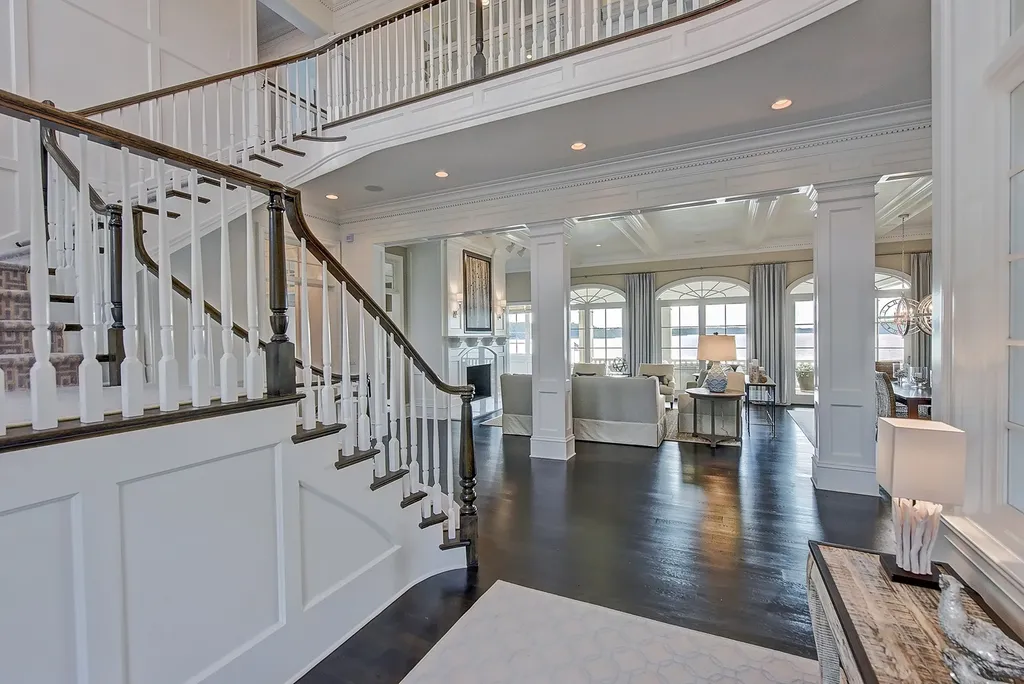 Indulge in the allure and character of the New England coast with this extraordinary Lake Norman estate. As you enter through the private gated drive, you'll be greeted by lush landscaping, creating a gardener's paradise. The estate offers wide open, long-range panoramic views that will take your breath away.