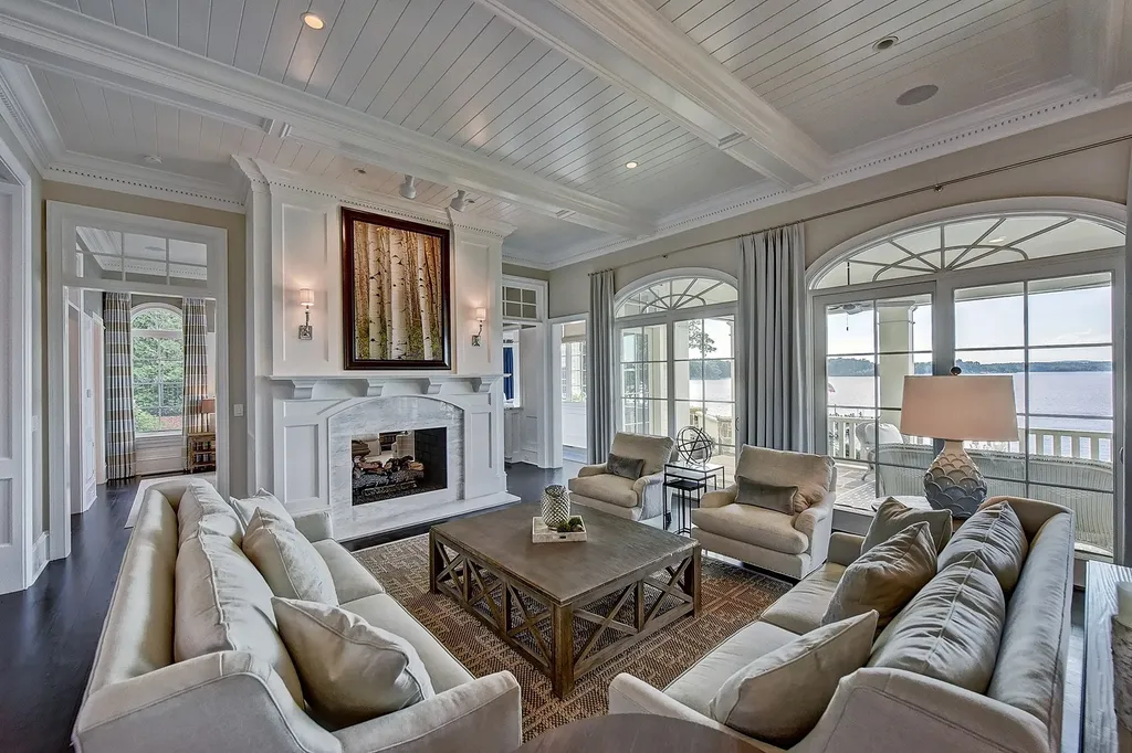 Indulge in the allure and character of the New England coast with this extraordinary Lake Norman estate. As you enter through the private gated drive, you'll be greeted by lush landscaping, creating a gardener's paradise. The estate offers wide open, long-range panoramic views that will take your breath away.