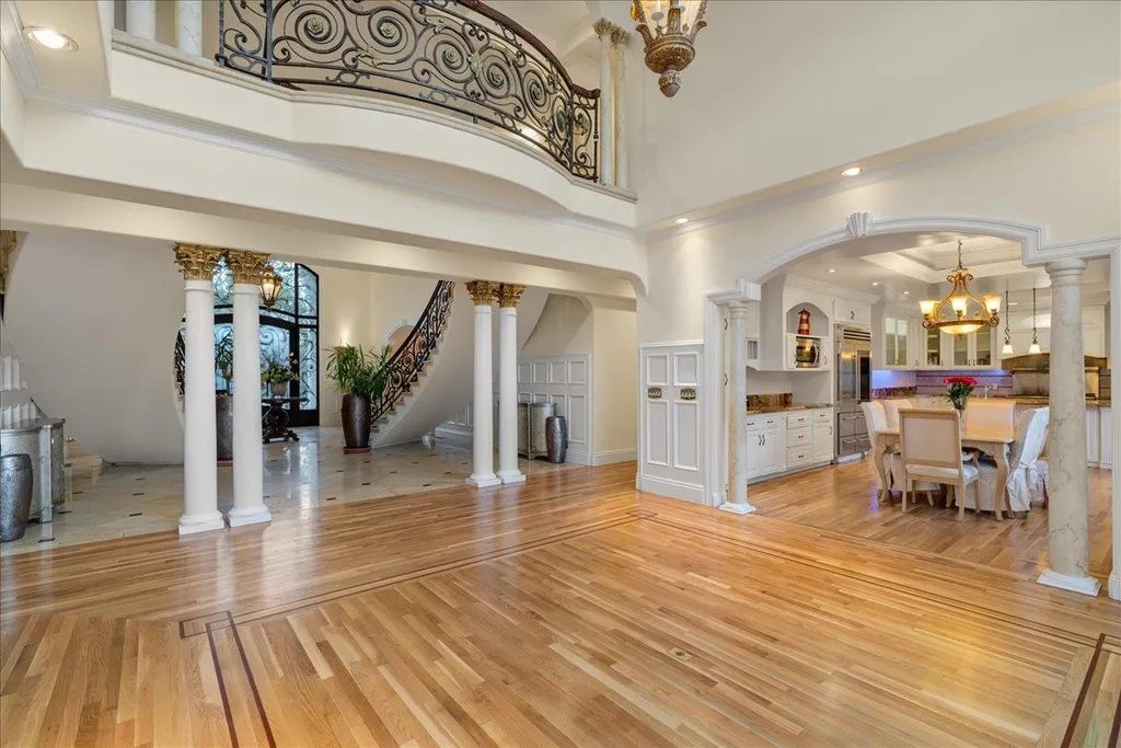 18911 Decatur Road Home in Los Gatos, California. This extraordinary estate in Monte Sereno has undergone a remarkable transformation with a remodel exceeding $5 million. It epitomizes the grandeur of a sprawling European luxury property, occupying a pristine and expansive 1.37-acre flat lot. This extraordinary estate in Monte Sereno has undergone a remarkable transformation with a remodel exceeding $5 million. It epitomizes the grandeur of a sprawling European luxury property, occupying a pristine and expansive 1.37-acre flat lot. The impressive slate roof structure encompasses approximately 17,000 square feet, boasting 10 bedrooms, 8 bathrooms, a separate guest house, an apartment, a 10-car garage, an elevator, an underground shooting range, an indoor basketball/racket ball court, a USTA tennis court, a resort-style lap pool, a great room, a home theatre, a bonus room, two formal libraries, and a home gym.
