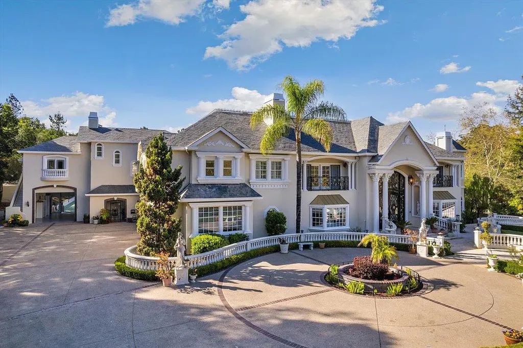 18911 Decatur Road Home in Los Gatos, California. This extraordinary estate in Monte Sereno has undergone a remarkable transformation with a remodel exceeding $5 million. It epitomizes the grandeur of a sprawling European luxury property, occupying a pristine and expansive 1.37-acre flat lot. This extraordinary estate in Monte Sereno has undergone a remarkable transformation with a remodel exceeding $5 million. It epitomizes the grandeur of a sprawling European luxury property, occupying a pristine and expansive 1.37-acre flat lot. The impressive slate roof structure encompasses approximately 17,000 square feet, boasting 10 bedrooms, 8 bathrooms, a separate guest house, an apartment, a 10-car garage, an elevator, an underground shooting range, an indoor basketball/racket ball court, a USTA tennis court, a resort-style lap pool, a great room, a home theatre, a bonus room, two formal libraries, and a home gym.