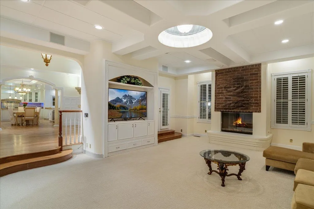18911 Decatur Road Home in Los Gatos, California. This extraordinary estate in Monte Sereno has undergone a remarkable transformation with a remodel exceeding $5 million. It epitomizes the grandeur of a sprawling European luxury property, occupying a pristine and expansive 1.37-acre flat lot. This extraordinary estate in Monte Sereno has undergone a remarkable transformation with a remodel exceeding $5 million. It epitomizes the grandeur of a sprawling European luxury property, occupying a pristine and expansive 1.37-acre flat lot. The impressive slate roof structure encompasses approximately 17,000 square feet, boasting 10 bedrooms, 8 bathrooms, a separate guest house, an apartment, a 10-car garage, an elevator, an underground shooting range, an indoor basketball/racket ball court, a USTA tennis court, a resort-style lap pool, a great room, a home theatre, a bonus room, two formal libraries, and a home gym.