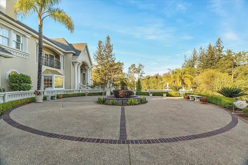 18911 Decatur Road Home in Los Gatos, California. This extraordinary estate in Monte Sereno has undergone a remarkable transformation with a remodel exceeding $5 million. It epitomizes the grandeur of a sprawling European luxury property, occupying a pristine and expansive 1.37-acre flat lot. This extraordinary estate in Monte Sereno has undergone a remarkable transformation with a remodel exceeding $5 million. It epitomizes the grandeur of a sprawling European luxury property, occupying a pristine and expansive 1.37-acre flat lot. The impressive slate roof structure encompasses approximately 17,000 square feet, boasting 10 bedrooms, 8 bathrooms, a separate guest house, an apartment, a 10-car garage, an elevator, an underground shooting range, an indoor basketball/racket ball court, a USTA tennis court, a resort-style lap pool, a great room, a home theatre, a bonus room, two formal libraries, and a home gym.