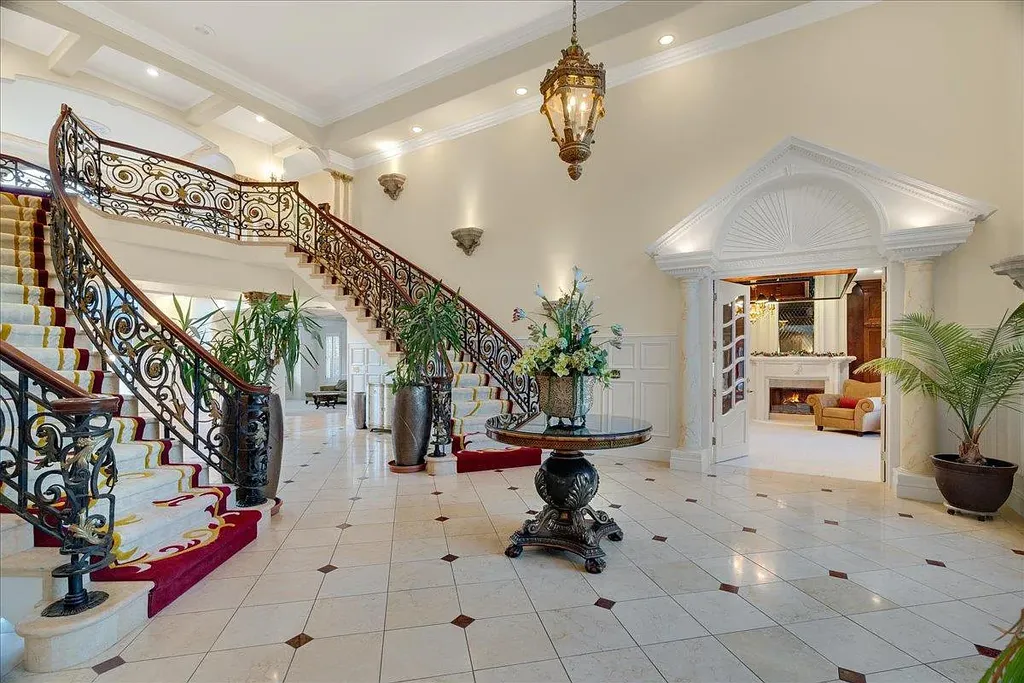18911 Decatur Road Home in Los Gatos, California. This extraordinary estate in Monte Sereno has undergone a remarkable transformation with a remodel exceeding $5 million. It epitomizes the grandeur of a sprawling European luxury property, occupying a pristine and expansive 1.37-acre flat lot. This extraordinary estate in Monte Sereno has undergone a remarkable transformation with a remodel exceeding $5 million. It epitomizes the grandeur of a sprawling European luxury property, occupying a pristine and expansive 1.37-acre flat lot. The impressive slate roof structure encompasses approximately 17,000 square feet, boasting 10 bedrooms, 8 bathrooms, a separate guest house, an apartment, a 10-car garage, an elevator, an underground shooting range, an indoor basketball/racket ball court, a USTA tennis court, a resort-style lap pool, a great room, a home theatre, a bonus room, two formal libraries, and a home gym.