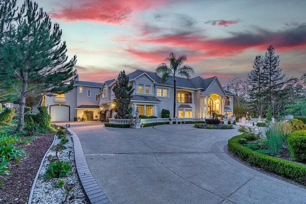 18911 Decatur Road Home in Los Gatos, California. This extraordinary estate in Monte Sereno has undergone a remarkable transformation with a remodel exceeding $5 million. It epitomizes the grandeur of a sprawling European luxury property, occupying a pristine and expansive 1.37-acre flat lot. This extraordinary estate in Monte Sereno has undergone a remarkable transformation with a remodel exceeding $5 million. It epitomizes the grandeur of a sprawling European luxury property, occupying a pristine and expansive 1.37-acre flat lot. The impressive slate roof structure encompasses approximately 17,000 square feet, boasting 10 bedrooms, 8 bathrooms, a separate guest house, an apartment, a 10-car garage, an elevator, an underground shooting range, an indoor basketball/racket ball court, a USTA tennis court, a resort-style lap pool, a great room, a home theatre, a bonus room, two formal libraries, and a home gym.