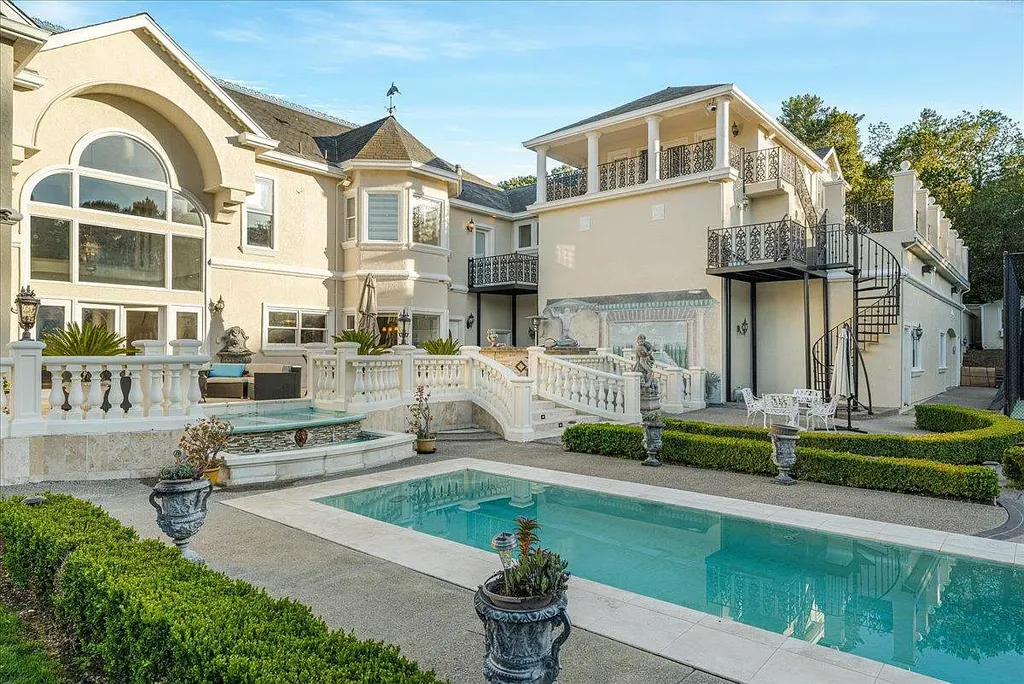 18911 Decatur Road Home in Los Gatos, California. This extraordinary estate in Monte Sereno has undergone a remarkable transformation with a remodel exceeding $5 million. It epitomizes the grandeur of a sprawling European luxury property, occupying a pristine and expansive 1.37-acre flat lot. This extraordinary estate in Monte Sereno has undergone a remarkable transformation with a remodel exceeding $5 million. It epitomizes the grandeur of a sprawling European luxury property, occupying a pristine and expansive 1.37-acre flat lot. The impressive slate roof structure encompasses approximately 17,000 square feet, boasting 10 bedrooms, 8 bathrooms, a separate guest house, an apartment, a 10-car garage, an elevator, an underground shooting range, an indoor basketball/racket ball court, a USTA tennis court, a resort-style lap pool, a great room, a home theatre, a bonus room, two formal libraries, and a home gym.