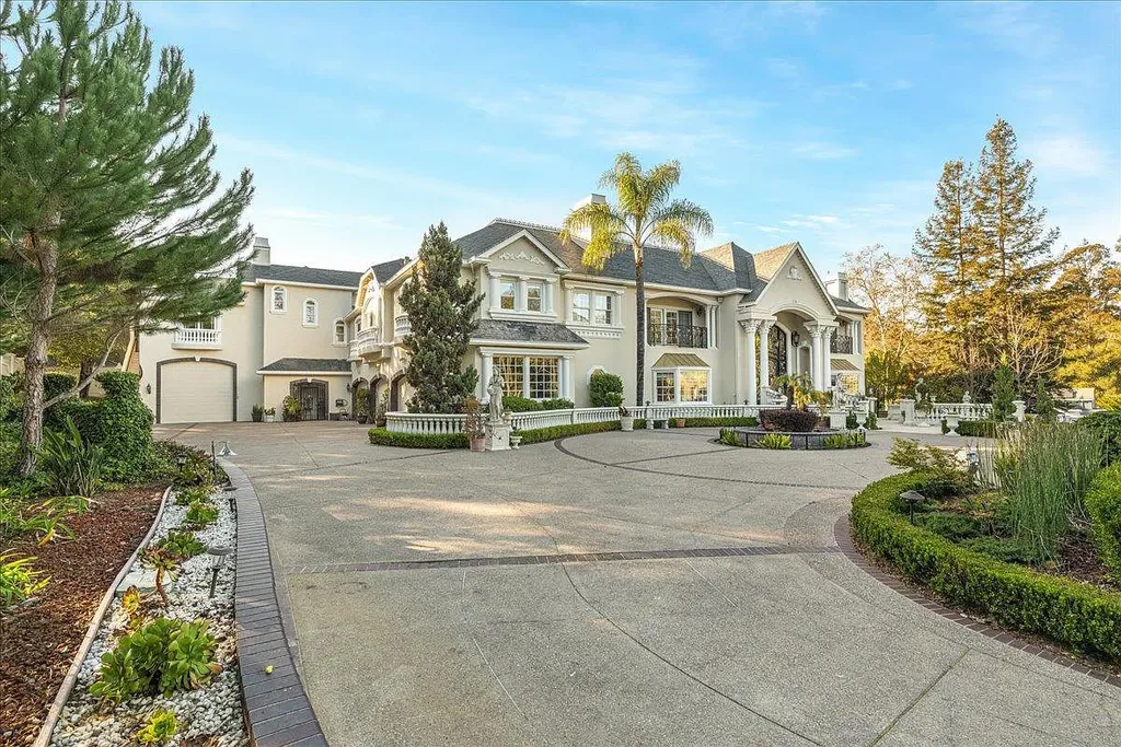 18911 Decatur Road Home in Los Gatos, California. This extraordinary estate in Monte Sereno has undergone a remarkable transformation with a remodel exceeding $5 million. It epitomizes the grandeur of a sprawling European luxury property, occupying a pristine and expansive 1.37-acre flat lot. This extraordinary estate in Monte Sereno has undergone a remarkable transformation with a remodel exceeding $5 million. It epitomizes the grandeur of a sprawling European luxury property, occupying a pristine and expansive 1.37-acre flat lot. The impressive slate roof structure encompasses approximately 17,000 square feet, boasting 10 bedrooms, 8 bathrooms, a separate guest house, an apartment, a 10-car garage, an elevator, an underground shooting range, an indoor basketball/racket ball court, a USTA tennis court, a resort-style lap pool, a great room, a home theatre, a bonus room, two formal libraries, and a home gym.