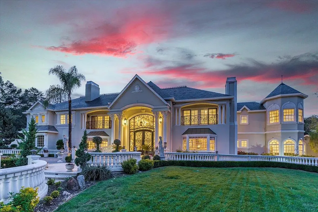 18911 Decatur Road Home in Los Gatos, California. This extraordinary estate in Monte Sereno has undergone a remarkable transformation with a remodel exceeding $5 million. It epitomizes the grandeur of a sprawling European luxury property, occupying a pristine and expansive 1.37-acre flat lot. This extraordinary estate in Monte Sereno has undergone a remarkable transformation with a remodel exceeding $5 million. It epitomizes the grandeur of a sprawling European luxury property, occupying a pristine and expansive 1.37-acre flat lot. The impressive slate roof structure encompasses approximately 17,000 square feet, boasting 10 bedrooms, 8 bathrooms, a separate guest house, an apartment, a 10-car garage, an elevator, an underground shooting range, an indoor basketball/racket ball court, a USTA tennis court, a resort-style lap pool, a great room, a home theatre, a bonus room, two formal libraries, and a home gym.