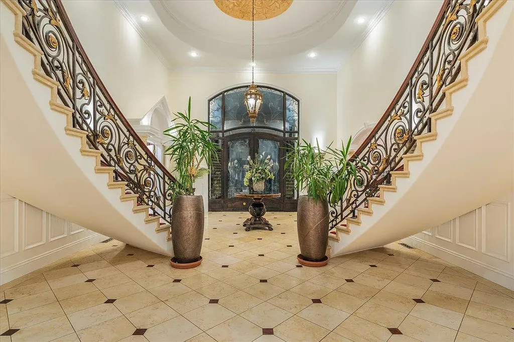 18911 Decatur Road Home in Los Gatos, California. This extraordinary estate in Monte Sereno has undergone a remarkable transformation with a remodel exceeding $5 million. It epitomizes the grandeur of a sprawling European luxury property, occupying a pristine and expansive 1.37-acre flat lot. This extraordinary estate in Monte Sereno has undergone a remarkable transformation with a remodel exceeding $5 million. It epitomizes the grandeur of a sprawling European luxury property, occupying a pristine and expansive 1.37-acre flat lot. The impressive slate roof structure encompasses approximately 17,000 square feet, boasting 10 bedrooms, 8 bathrooms, a separate guest house, an apartment, a 10-car garage, an elevator, an underground shooting range, an indoor basketball/racket ball court, a USTA tennis court, a resort-style lap pool, a great room, a home theatre, a bonus room, two formal libraries, and a home gym.