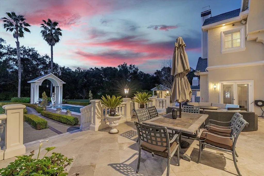 18911 Decatur Road Home in Los Gatos, California. This extraordinary estate in Monte Sereno has undergone a remarkable transformation with a remodel exceeding $5 million. It epitomizes the grandeur of a sprawling European luxury property, occupying a pristine and expansive 1.37-acre flat lot. This extraordinary estate in Monte Sereno has undergone a remarkable transformation with a remodel exceeding $5 million. It epitomizes the grandeur of a sprawling European luxury property, occupying a pristine and expansive 1.37-acre flat lot. The impressive slate roof structure encompasses approximately 17,000 square feet, boasting 10 bedrooms, 8 bathrooms, a separate guest house, an apartment, a 10-car garage, an elevator, an underground shooting range, an indoor basketball/racket ball court, a USTA tennis court, a resort-style lap pool, a great room, a home theatre, a bonus room, two formal libraries, and a home gym.