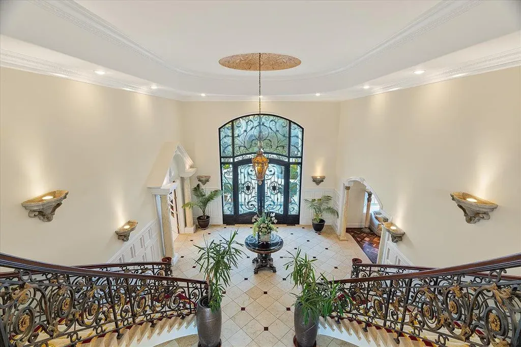 18911 Decatur Road Home in Los Gatos, California. This extraordinary estate in Monte Sereno has undergone a remarkable transformation with a remodel exceeding $5 million. It epitomizes the grandeur of a sprawling European luxury property, occupying a pristine and expansive 1.37-acre flat lot. This extraordinary estate in Monte Sereno has undergone a remarkable transformation with a remodel exceeding $5 million. It epitomizes the grandeur of a sprawling European luxury property, occupying a pristine and expansive 1.37-acre flat lot. The impressive slate roof structure encompasses approximately 17,000 square feet, boasting 10 bedrooms, 8 bathrooms, a separate guest house, an apartment, a 10-car garage, an elevator, an underground shooting range, an indoor basketball/racket ball court, a USTA tennis court, a resort-style lap pool, a great room, a home theatre, a bonus room, two formal libraries, and a home gym.