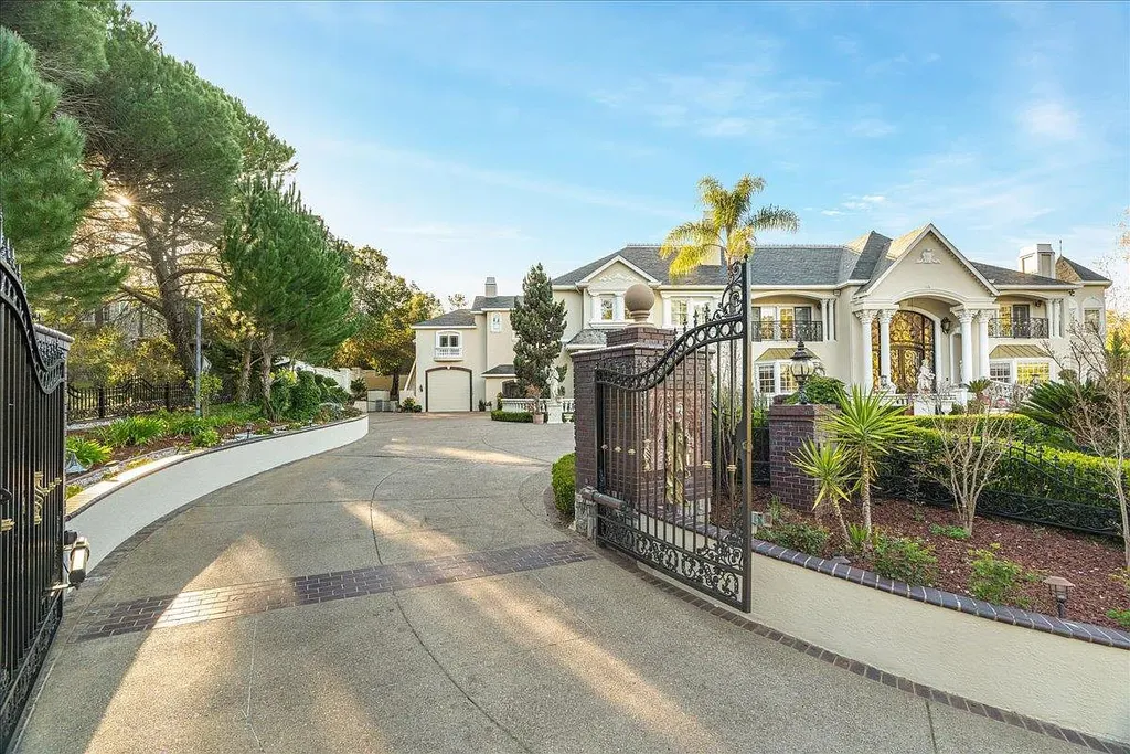 18911 Decatur Road Home in Los Gatos, California. This extraordinary estate in Monte Sereno has undergone a remarkable transformation with a remodel exceeding $5 million. It epitomizes the grandeur of a sprawling European luxury property, occupying a pristine and expansive 1.37-acre flat lot. This extraordinary estate in Monte Sereno has undergone a remarkable transformation with a remodel exceeding $5 million. It epitomizes the grandeur of a sprawling European luxury property, occupying a pristine and expansive 1.37-acre flat lot. The impressive slate roof structure encompasses approximately 17,000 square feet, boasting 10 bedrooms, 8 bathrooms, a separate guest house, an apartment, a 10-car garage, an elevator, an underground shooting range, an indoor basketball/racket ball court, a USTA tennis court, a resort-style lap pool, a great room, a home theatre, a bonus room, two formal libraries, and a home gym.