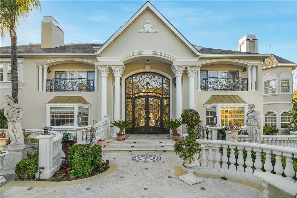 18911 Decatur Road Home in Los Gatos, California. This extraordinary estate in Monte Sereno has undergone a remarkable transformation with a remodel exceeding $5 million. It epitomizes the grandeur of a sprawling European luxury property, occupying a pristine and expansive 1.37-acre flat lot. This extraordinary estate in Monte Sereno has undergone a remarkable transformation with a remodel exceeding $5 million. It epitomizes the grandeur of a sprawling European luxury property, occupying a pristine and expansive 1.37-acre flat lot. The impressive slate roof structure encompasses approximately 17,000 square feet, boasting 10 bedrooms, 8 bathrooms, a separate guest house, an apartment, a 10-car garage, an elevator, an underground shooting range, an indoor basketball/racket ball court, a USTA tennis court, a resort-style lap pool, a great room, a home theatre, a bonus room, two formal libraries, and a home gym.