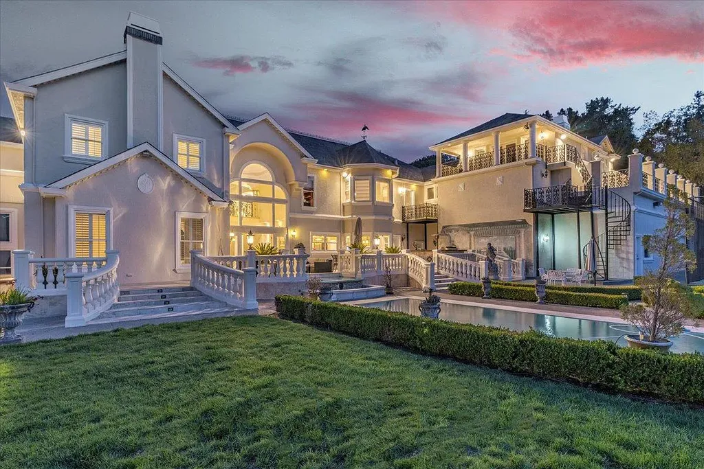 18911 Decatur Road Home in Los Gatos, California. This extraordinary estate in Monte Sereno has undergone a remarkable transformation with a remodel exceeding $5 million. It epitomizes the grandeur of a sprawling European luxury property, occupying a pristine and expansive 1.37-acre flat lot. This extraordinary estate in Monte Sereno has undergone a remarkable transformation with a remodel exceeding $5 million. It epitomizes the grandeur of a sprawling European luxury property, occupying a pristine and expansive 1.37-acre flat lot. The impressive slate roof structure encompasses approximately 17,000 square feet, boasting 10 bedrooms, 8 bathrooms, a separate guest house, an apartment, a 10-car garage, an elevator, an underground shooting range, an indoor basketball/racket ball court, a USTA tennis court, a resort-style lap pool, a great room, a home theatre, a bonus room, two formal libraries, and a home gym.