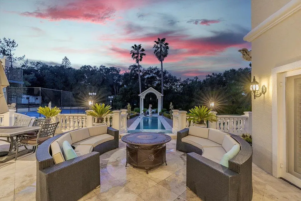 18911 Decatur Road Home in Los Gatos, California. This extraordinary estate in Monte Sereno has undergone a remarkable transformation with a remodel exceeding $5 million. It epitomizes the grandeur of a sprawling European luxury property, occupying a pristine and expansive 1.37-acre flat lot. This extraordinary estate in Monte Sereno has undergone a remarkable transformation with a remodel exceeding $5 million. It epitomizes the grandeur of a sprawling European luxury property, occupying a pristine and expansive 1.37-acre flat lot. The impressive slate roof structure encompasses approximately 17,000 square feet, boasting 10 bedrooms, 8 bathrooms, a separate guest house, an apartment, a 10-car garage, an elevator, an underground shooting range, an indoor basketball/racket ball court, a USTA tennis court, a resort-style lap pool, a great room, a home theatre, a bonus room, two formal libraries, and a home gym.