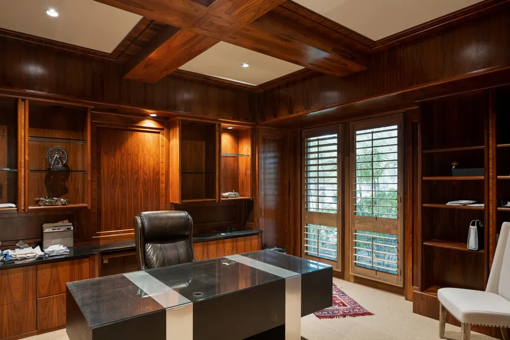 25120 Jim Bridger Road Home in Hidden Hills, California. Situated on a spacious lot of nearly one and a half acres in the prestigious Ashley Ridge enclave of Hidden Hills, a guard-gated community, this custom-designed estate spans 16,000 square feet and showcases impeccable details against a backdrop of breathtaking canyon views.