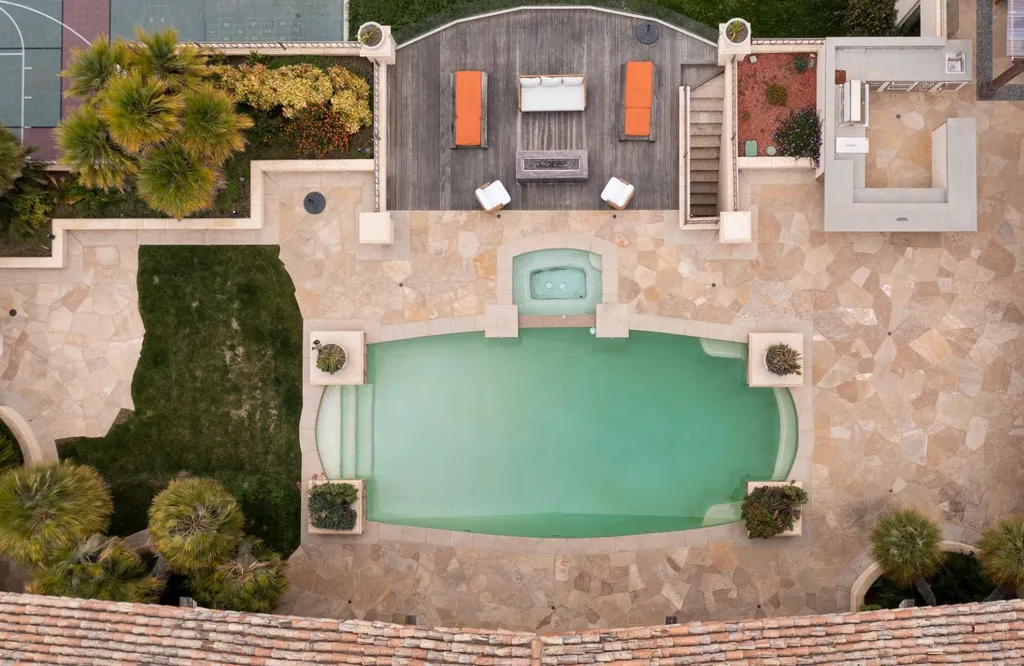 25120 Jim Bridger Road Home in Hidden Hills, California. Situated on a spacious lot of nearly one and a half acres in the prestigious Ashley Ridge enclave of Hidden Hills, a guard-gated community, this custom-designed estate spans 16,000 square feet and showcases impeccable details against a backdrop of breathtaking canyon views.