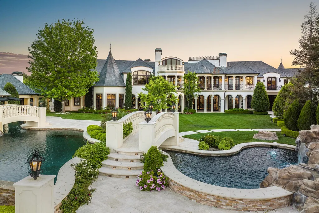 25365 Prado De La Felicidad Home in Calabasas, California. Calabasas, California - Prepare to be captivated by one of the most stunning properties in all of Calabasas. This extraordinary architectural masterpiece showcases French influence and design, nestled behind the prestigious second gate in The Estates at The Oaks. Situated on over 1.1 acres of land and boasting panoramic city and mountain views, this residence is a true testament to luxury and craftsmanship.