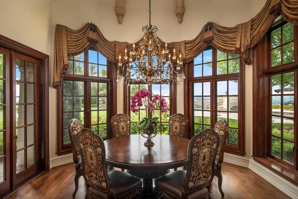 25365 Prado De La Felicidad Home in Calabasas, California. Calabasas, California - Prepare to be captivated by one of the most stunning properties in all of Calabasas. This extraordinary architectural masterpiece showcases French influence and design, nestled behind the prestigious second gate in The Estates at The Oaks. Situated on over 1.1 acres of land and boasting panoramic city and mountain views, this residence is a true testament to luxury and craftsmanship.