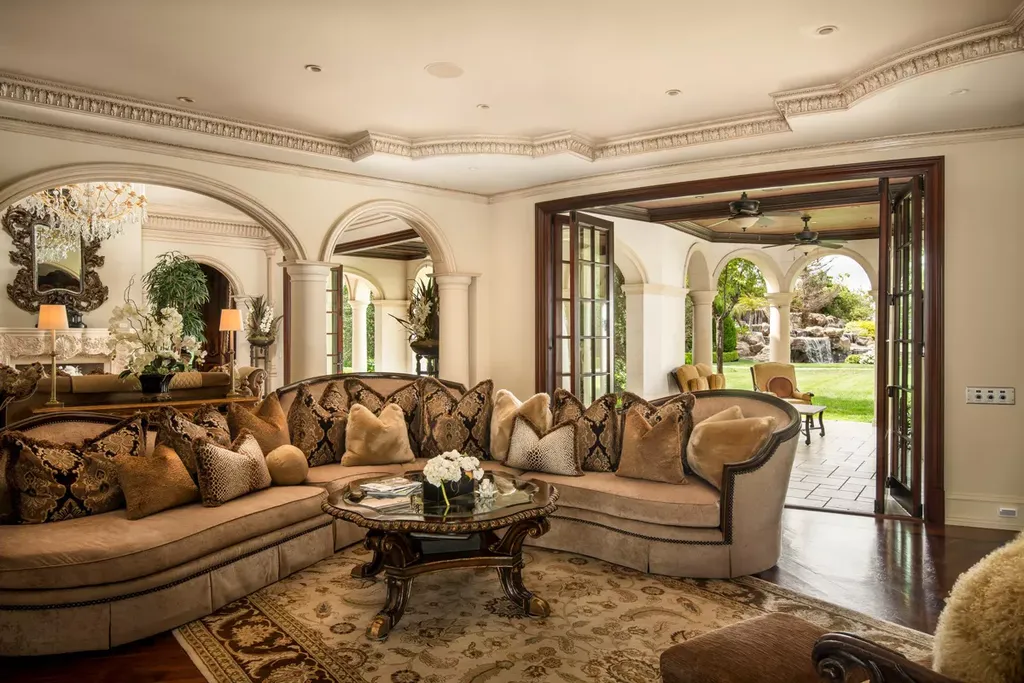 25365 Prado De La Felicidad Home in Calabasas, California. Calabasas, California - Prepare to be captivated by one of the most stunning properties in all of Calabasas. This extraordinary architectural masterpiece showcases French influence and design, nestled behind the prestigious second gate in The Estates at The Oaks. Situated on over 1.1 acres of land and boasting panoramic city and mountain views, this residence is a true testament to luxury and craftsmanship.