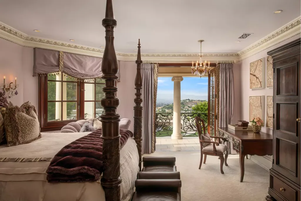 25365 Prado De La Felicidad Home in Calabasas, California. Calabasas, California - Prepare to be captivated by one of the most stunning properties in all of Calabasas. This extraordinary architectural masterpiece showcases French influence and design, nestled behind the prestigious second gate in The Estates at The Oaks. Situated on over 1.1 acres of land and boasting panoramic city and mountain views, this residence is a true testament to luxury and craftsmanship.