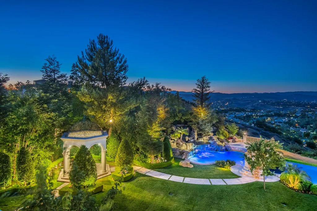 25365 Prado De La Felicidad Home in Calabasas, California. Calabasas, California - Prepare to be captivated by one of the most stunning properties in all of Calabasas. This extraordinary architectural masterpiece showcases French influence and design, nestled behind the prestigious second gate in The Estates at The Oaks. Situated on over 1.1 acres of land and boasting panoramic city and mountain views, this residence is a true testament to luxury and craftsmanship.