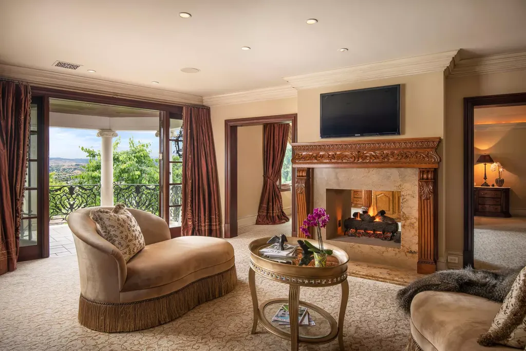25365 Prado De La Felicidad Home in Calabasas, California. Calabasas, California - Prepare to be captivated by one of the most stunning properties in all of Calabasas. This extraordinary architectural masterpiece showcases French influence and design, nestled behind the prestigious second gate in The Estates at The Oaks. Situated on over 1.1 acres of land and boasting panoramic city and mountain views, this residence is a true testament to luxury and craftsmanship.