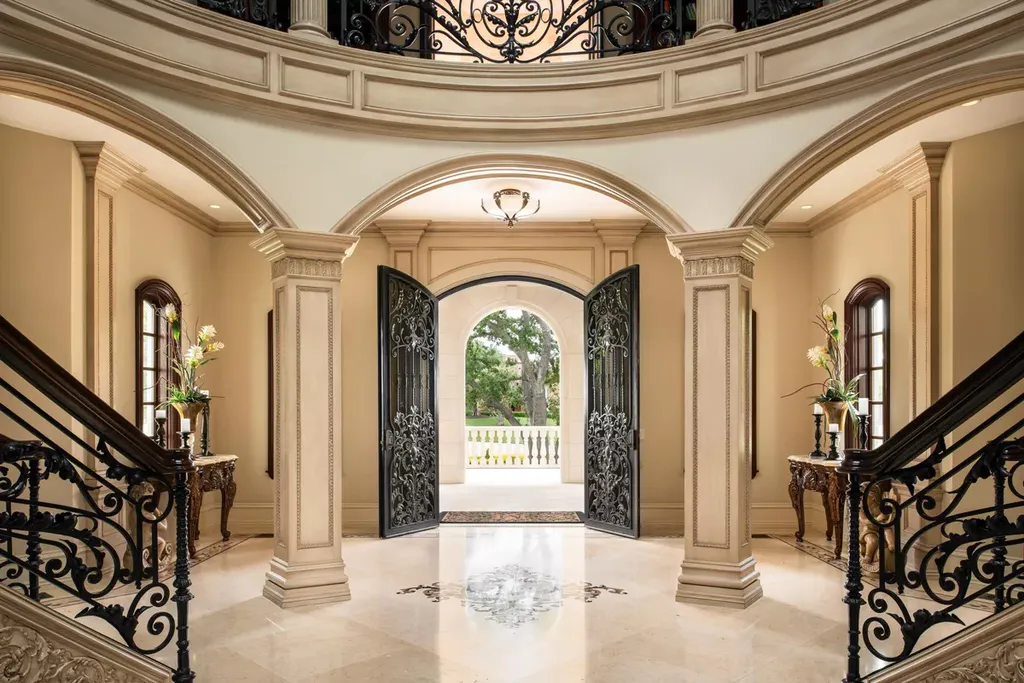 25365 Prado De La Felicidad Home in Calabasas, California. Calabasas, California - Prepare to be captivated by one of the most stunning properties in all of Calabasas. This extraordinary architectural masterpiece showcases French influence and design, nestled behind the prestigious second gate in The Estates at The Oaks. Situated on over 1.1 acres of land and boasting panoramic city and mountain views, this residence is a true testament to luxury and craftsmanship.