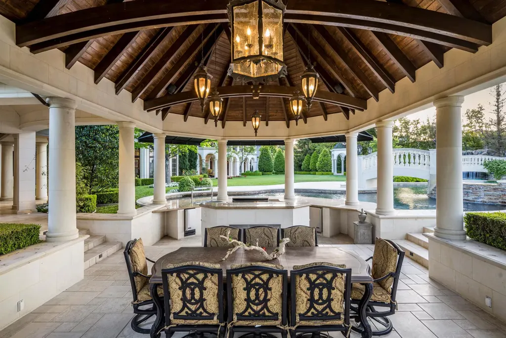 25365 Prado De La Felicidad Home in Calabasas, California. Calabasas, California - Prepare to be captivated by one of the most stunning properties in all of Calabasas. This extraordinary architectural masterpiece showcases French influence and design, nestled behind the prestigious second gate in The Estates at The Oaks. Situated on over 1.1 acres of land and boasting panoramic city and mountain views, this residence is a true testament to luxury and craftsmanship.