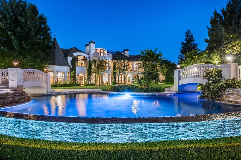 25365 Prado De La Felicidad Home in Calabasas, California. Calabasas, California - Prepare to be captivated by one of the most stunning properties in all of Calabasas. This extraordinary architectural masterpiece showcases French influence and design, nestled behind the prestigious second gate in The Estates at The Oaks. Situated on over 1.1 acres of land and boasting panoramic city and mountain views, this residence is a true testament to luxury and craftsmanship.