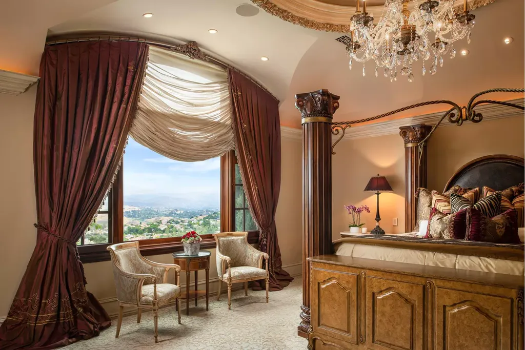 25365 Prado De La Felicidad Home in Calabasas, California. Calabasas, California - Prepare to be captivated by one of the most stunning properties in all of Calabasas. This extraordinary architectural masterpiece showcases French influence and design, nestled behind the prestigious second gate in The Estates at The Oaks. Situated on over 1.1 acres of land and boasting panoramic city and mountain views, this residence is a true testament to luxury and craftsmanship.
