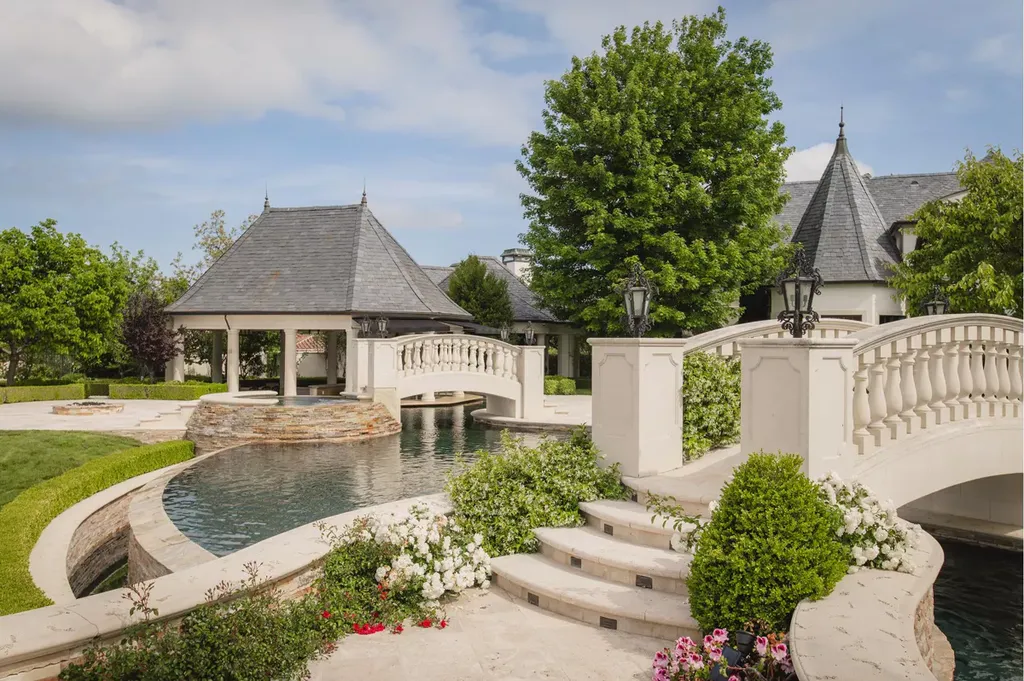 25365 Prado De La Felicidad Home in Calabasas, California. Calabasas, California - Prepare to be captivated by one of the most stunning properties in all of Calabasas. This extraordinary architectural masterpiece showcases French influence and design, nestled behind the prestigious second gate in The Estates at The Oaks. Situated on over 1.1 acres of land and boasting panoramic city and mountain views, this residence is a true testament to luxury and craftsmanship.