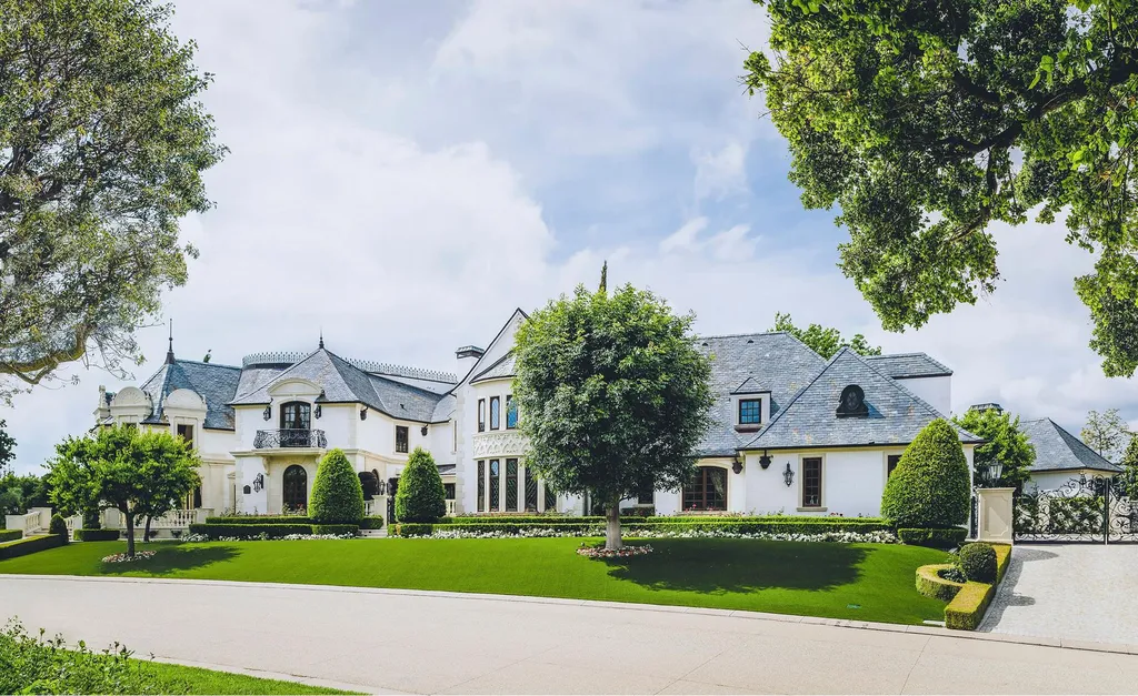 25365 Prado De La Felicidad Home in Calabasas, California. Calabasas, California - Prepare to be captivated by one of the most stunning properties in all of Calabasas. This extraordinary architectural masterpiece showcases French influence and design, nestled behind the prestigious second gate in The Estates at The Oaks. Situated on over 1.1 acres of land and boasting panoramic city and mountain views, this residence is a true testament to luxury and craftsmanship.