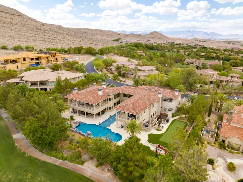 27 Eagles Landing Lane Home in Las Vegas, Nevada. Welcome to the prestigious Southern Highlands Golf Club, where you'll find the iconic Mediterranean estate at 27 Eagles Landing Lane. This custom-designed home offers an unmatched living experience, boasting captivating views of the city, mountains, and golf course. Every detail of this Richard Luke masterpiece has been meticulously crafted, from the architectural iron details to the Turkish marble floors.