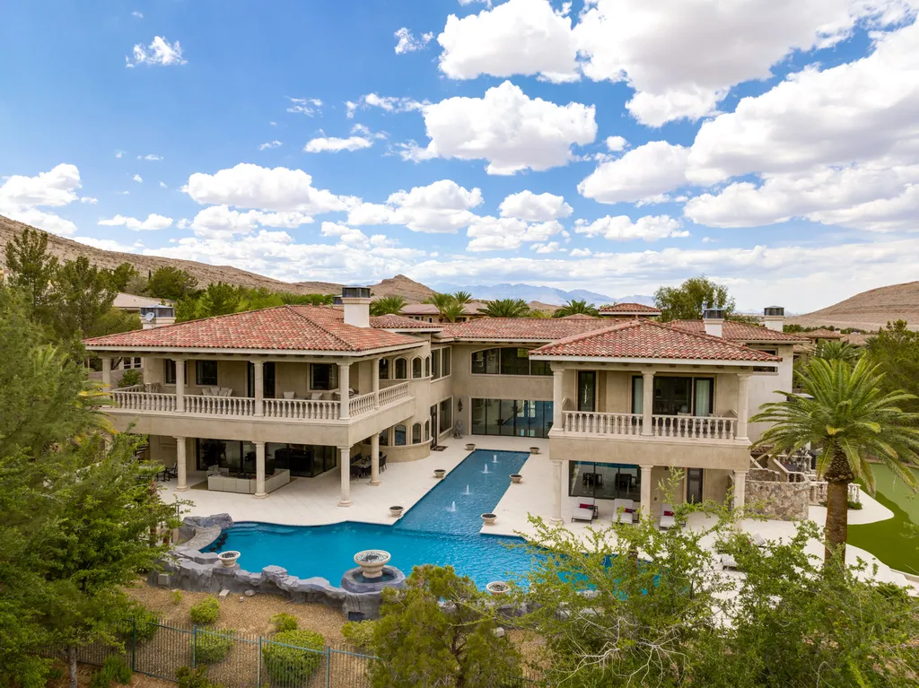 27 Eagles Landing Lane Home in Las Vegas, Nevada. Welcome to the prestigious Southern Highlands Golf Club, where you'll find the iconic Mediterranean estate at 27 Eagles Landing Lane. This custom-designed home offers an unmatched living experience, boasting captivating views of the city, mountains, and golf course. Every detail of this Richard Luke masterpiece has been meticulously crafted, from the architectural iron details to the Turkish marble floors.