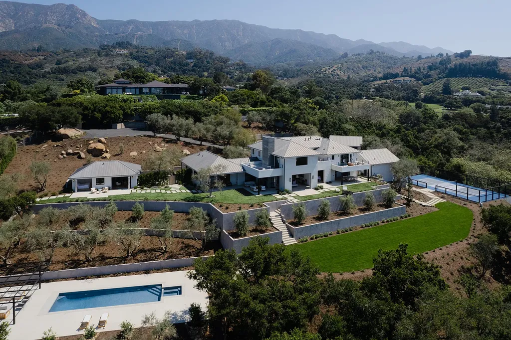 2957 E Valley Road Home in Santa Barbara, California. Embark on an extraordinary journey as you step into this newly completed, expertly designed compound boasting breathtaking ocean, mountain, and hillside views. With a harmonious blend of modern aesthetics and a romantic ambiance, this property is a testament to patience and the pursuit of perfection. Welcome to a haven where high design seamlessly merges with relaxed livability, creating an unparalleled living experience.