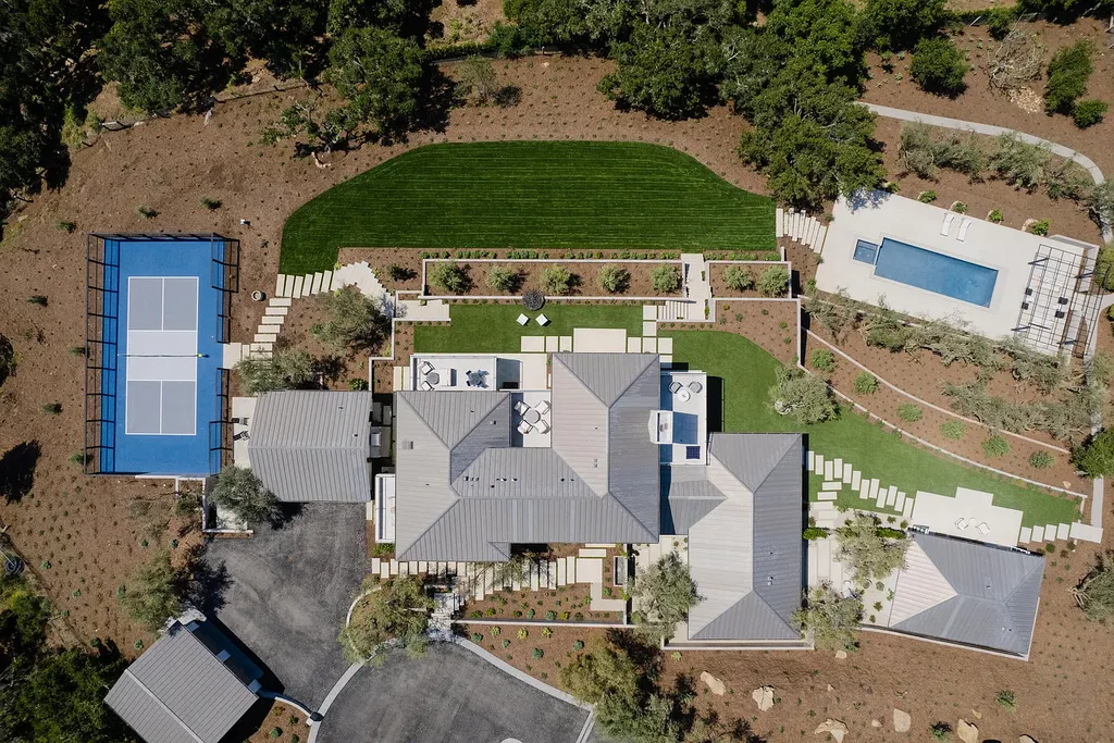 2957 E Valley Road Home in Santa Barbara, California. Embark on an extraordinary journey as you step into this newly completed, expertly designed compound boasting breathtaking ocean, mountain, and hillside views. With a harmonious blend of modern aesthetics and a romantic ambiance, this property is a testament to patience and the pursuit of perfection. Welcome to a haven where high design seamlessly merges with relaxed livability, creating an unparalleled living experience.